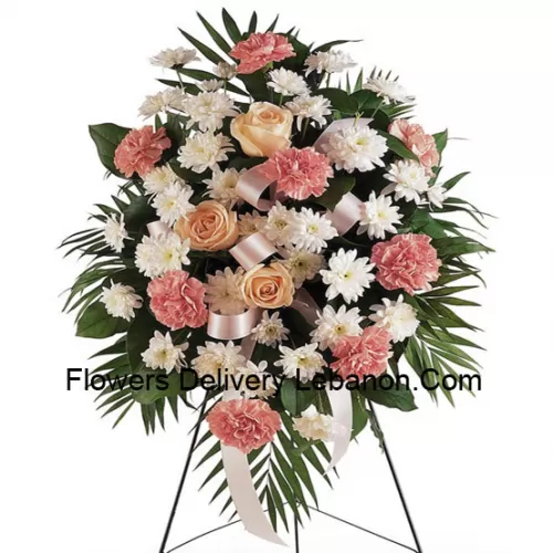Un hermoso arreglo de flores de condolencia que viene con un soporte (solo entrega en Metro Manila, para entregas fuera de Manila, el producto puede ser sustituido por otro arreglo de condolencia de igual valor)
