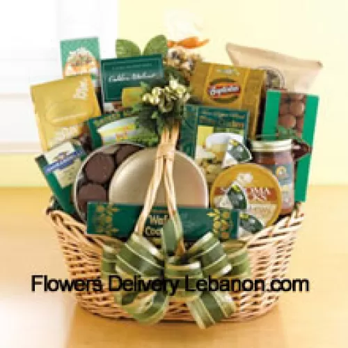 Start a tradition of sending good taste to your recipient this year. Our classic wicker basket comes piled high with a gourmet assortment that is sure to please the recipient. We accent the basket with green and gold ribbon and accents to make a great impression. Inside, your recipient will discover an assortment that features something for everyone: Lindt chocolate truffles, smoked almonds, walnut cookies, chocolate cookies, chocolate-covered popcorn, cheese, crackers, a Ghirardelli chocolate bar, tortilla chips, salsa, chocolate wafer cookies , cheese swirls, and chocolate-covered sandwich cookies. (Please Note That We Reserve The Right To Substitute Any Product With A Suitable Product Of Equal Value In Case Of Non-Availability Of A Certain Product)